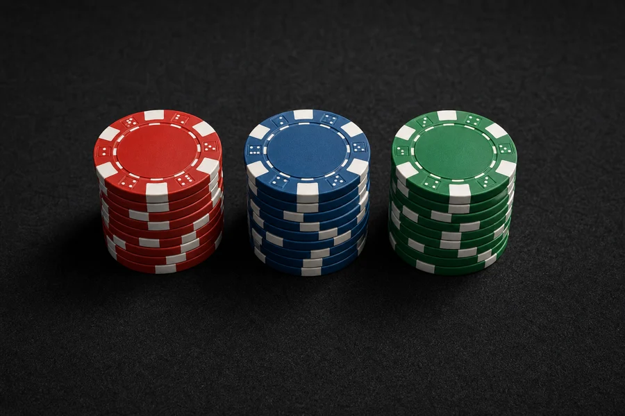 Casino chips in three piles for session budgeting